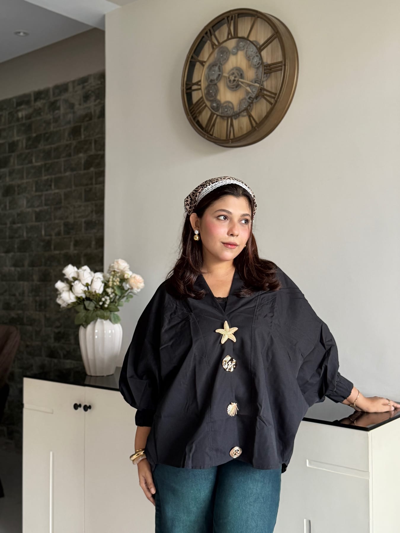 Black batwing top with gold shell buttons
