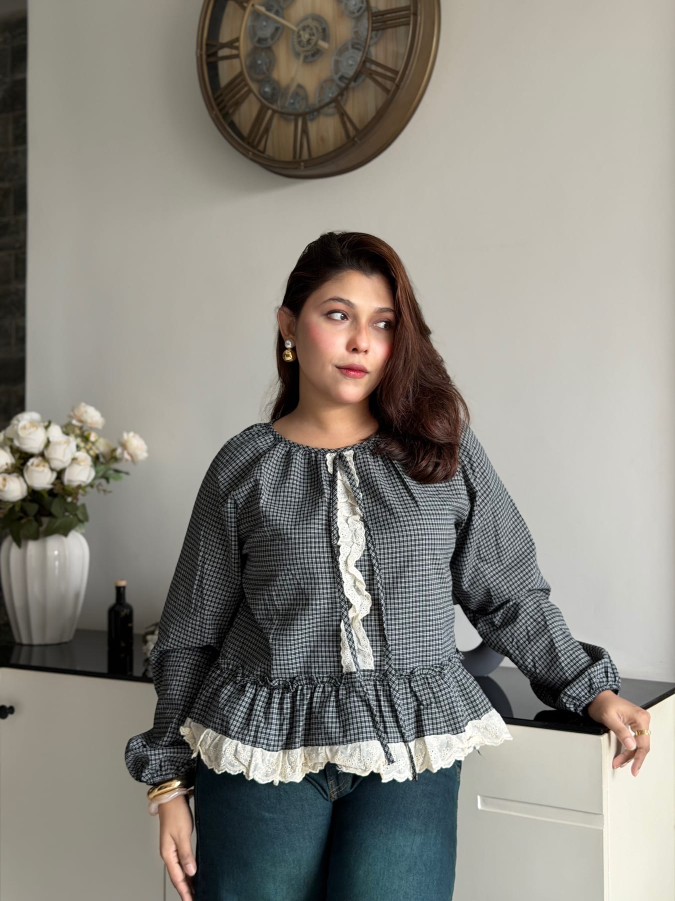 Grey gingham blouse with ruffle hem